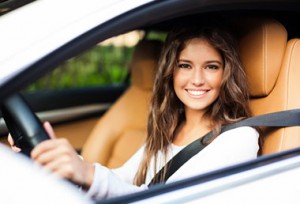 woman driving car with auto insurance